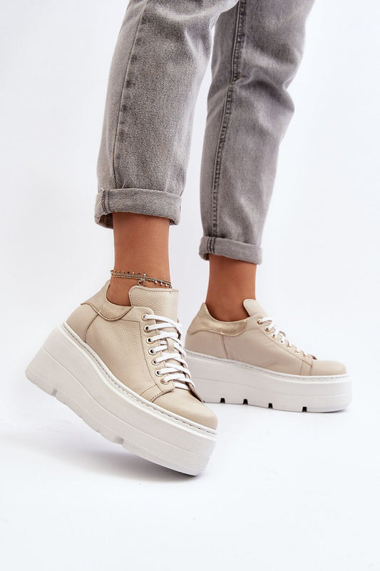 Stylish women's natural leather sports shoes from Step in Style featuring a massive platform, showcased on a model wearing grey jeans, highlighting comfort and elegance in every step.