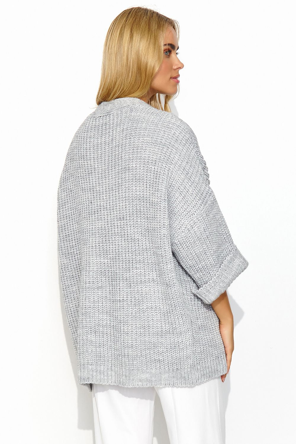Luxurious Makadamia buttonless cardigan featuring wide sleeves, perfect for elegant casual styling.