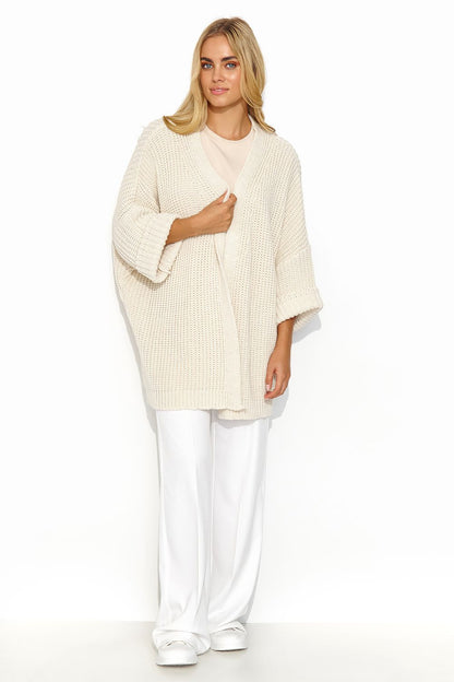 Chic Makadamia cardigan styled with a dress, showcasing its elegant and classy appeal.