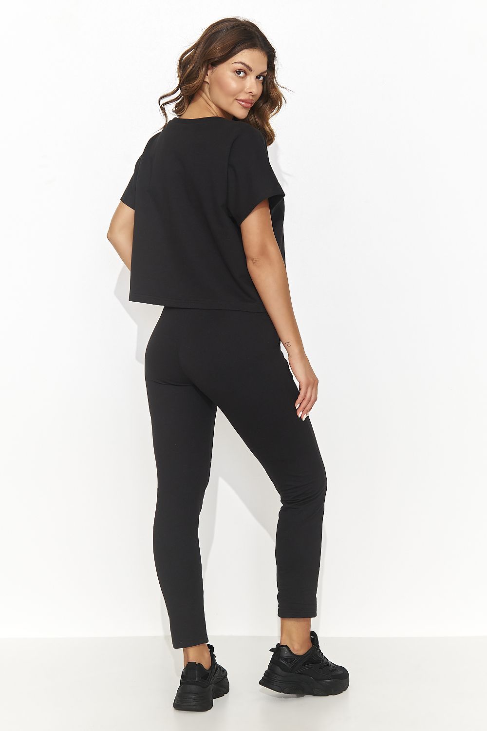 Close-up of the Numinou knitted set fabric, highlighting the exquisite texture and premium quality of the cotton and spandex blend, embodying elegant casual style.