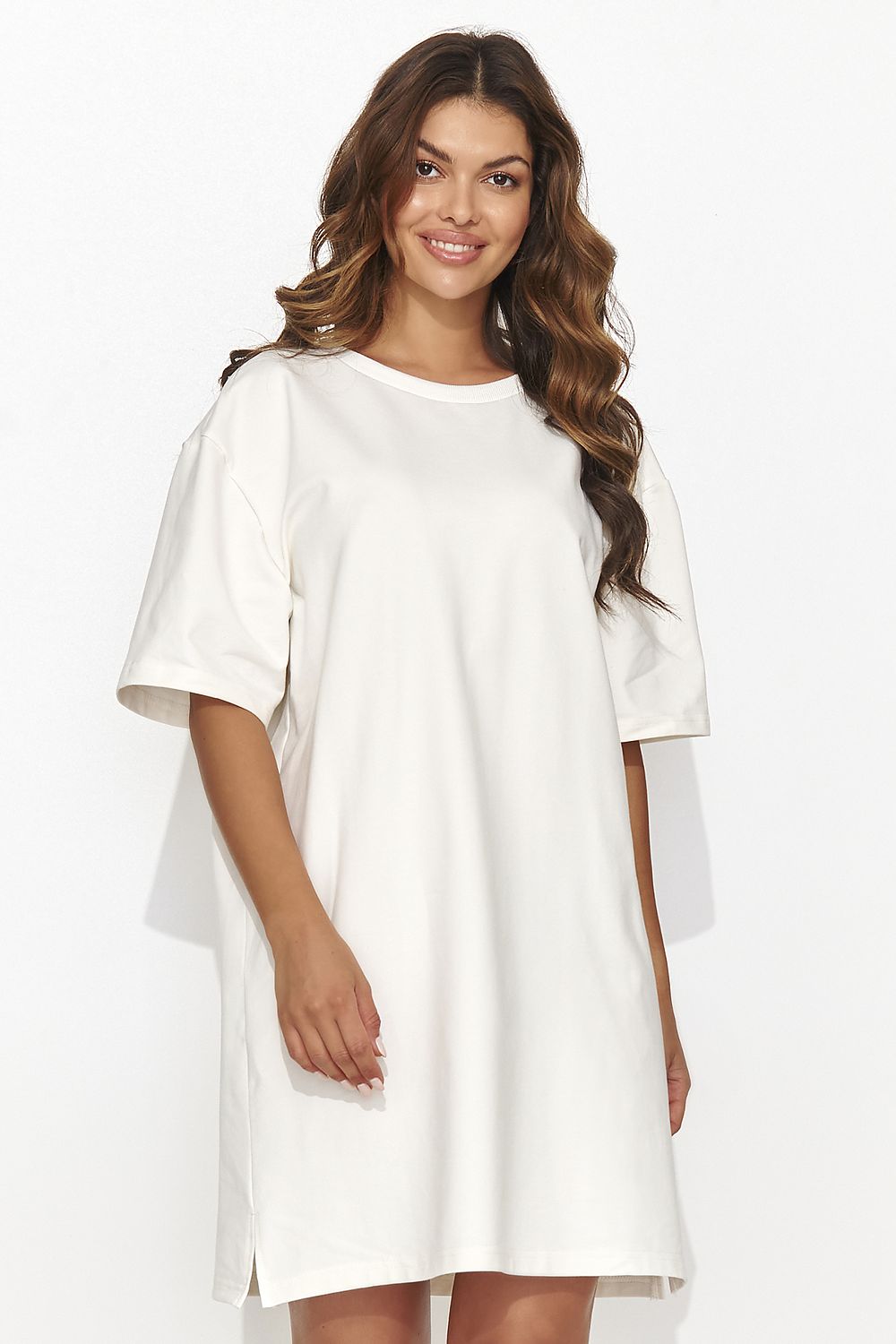 Elegant Numinou short tracksuit dress featuring a modern design with subtle back cutout and gold accent, perfect for casual chic gatherings.