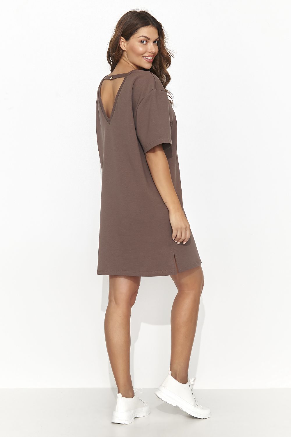 Back view of the Numinou short tracksuit dress displaying the subtle sensual cutout design, ideal for adding flair to your activewear.