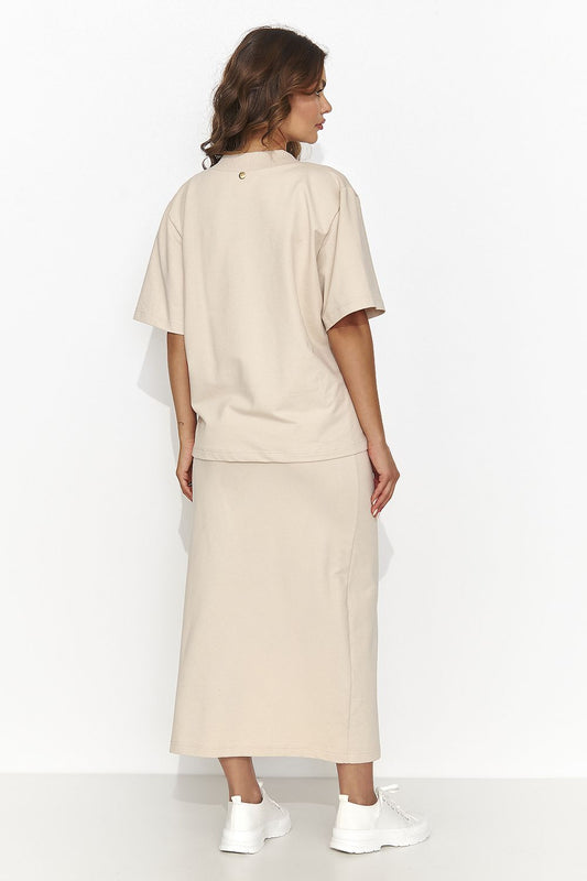 Charming woman's 2-piece outfit including a knee-length pencil skirt and loose-fitting heart neckline blouse from Numinou, showcasing elegant styles in multiple colours.