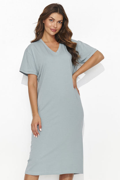 Charming back view of the Numinou knitted dress showcasing its delicate slit and sewn-in tinsel detail.