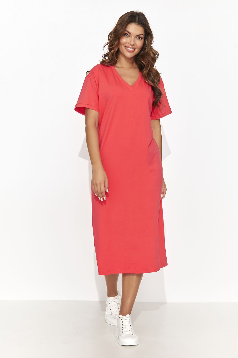 Lifestyle image of a model wearing the Numinou casual knitted dress, illustrating its stylish versatility for summer outings.