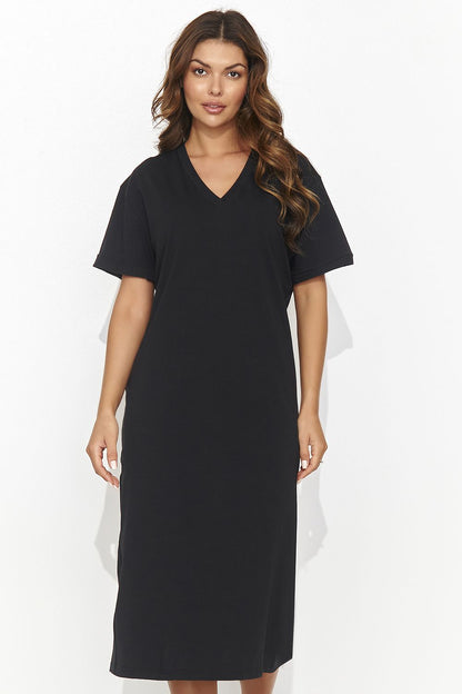 Back view of Numinou Casual Knitted Dress, emphasizing the exquisite back slit and elegant tinsel detail.