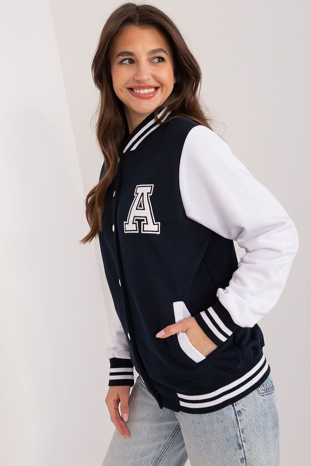 Relevance women's sports sweatshirt showcasing a modern stand-up collar and contrasting decorative patches, perfect for stylish athletic wear.