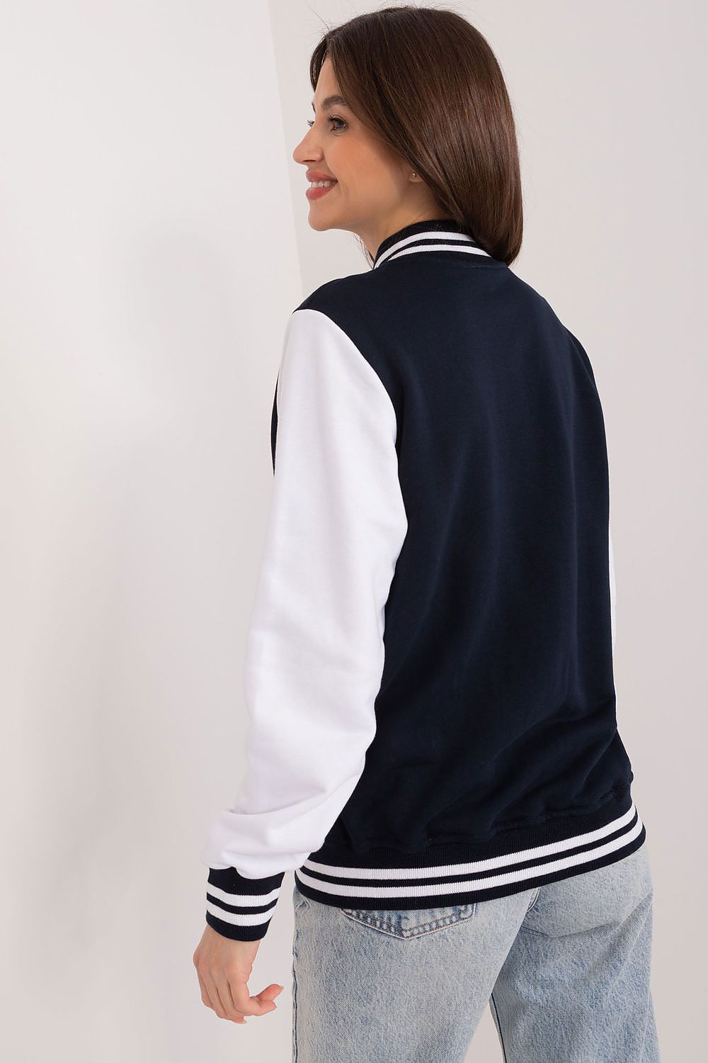 Sleek white cotton sweatshirt for women by Relevance, designed with long sleeves, slip pockets, and a blend of comfort and sophistication for active lifestyles.