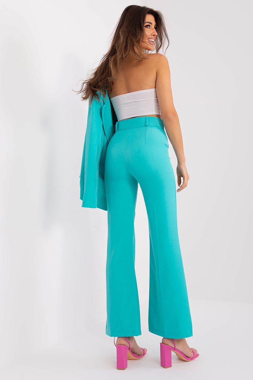 Elegant Women's Flared Trousers by Italy Moda featuring a high-rise design made from luxurious polyester, showcasing a modern silhouette with sophisticated flared legs.