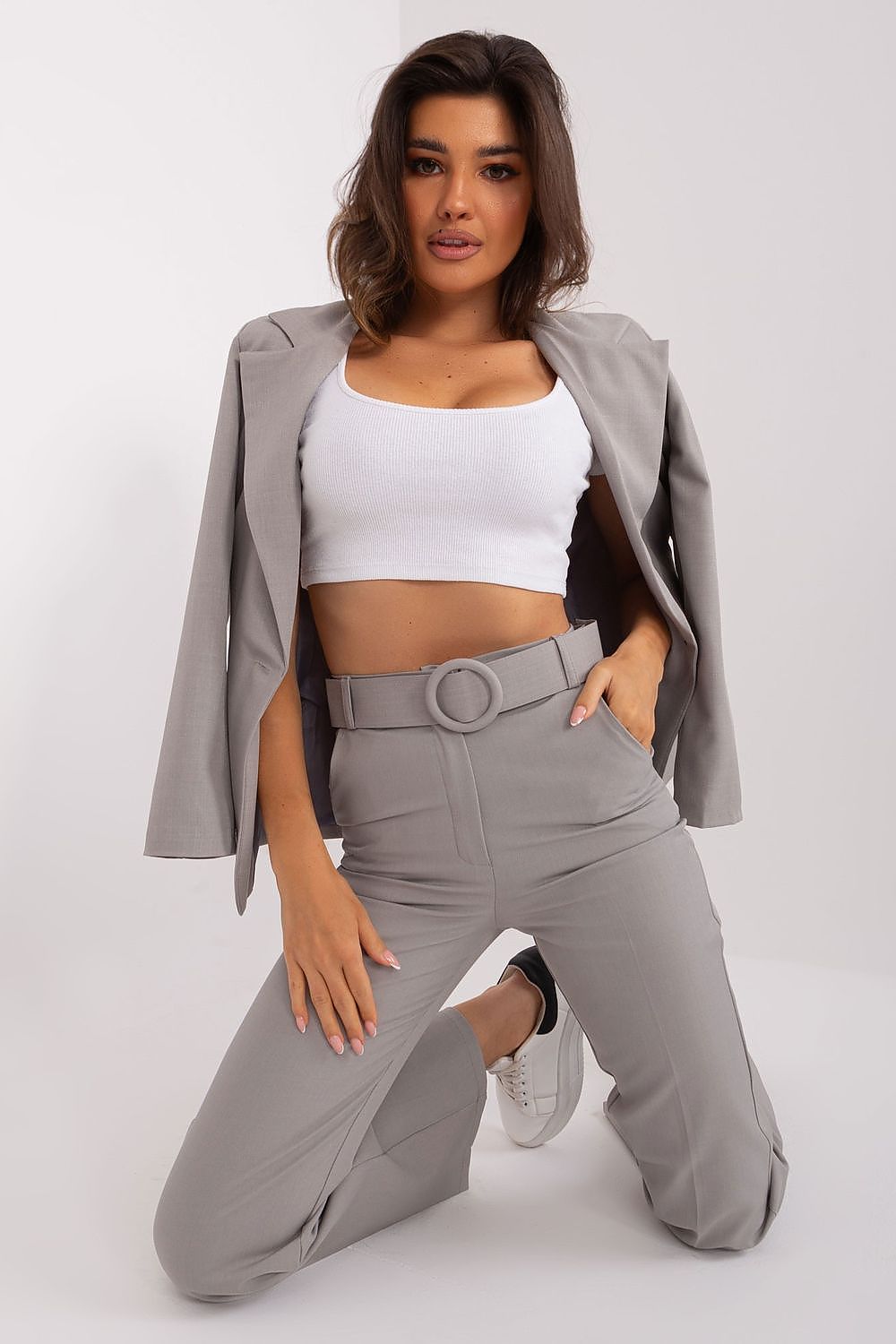 Italy Moda's elegant women's trousers with a flared leg design, high-rise fit, and added pockets for practicality, ideal for business meetings.