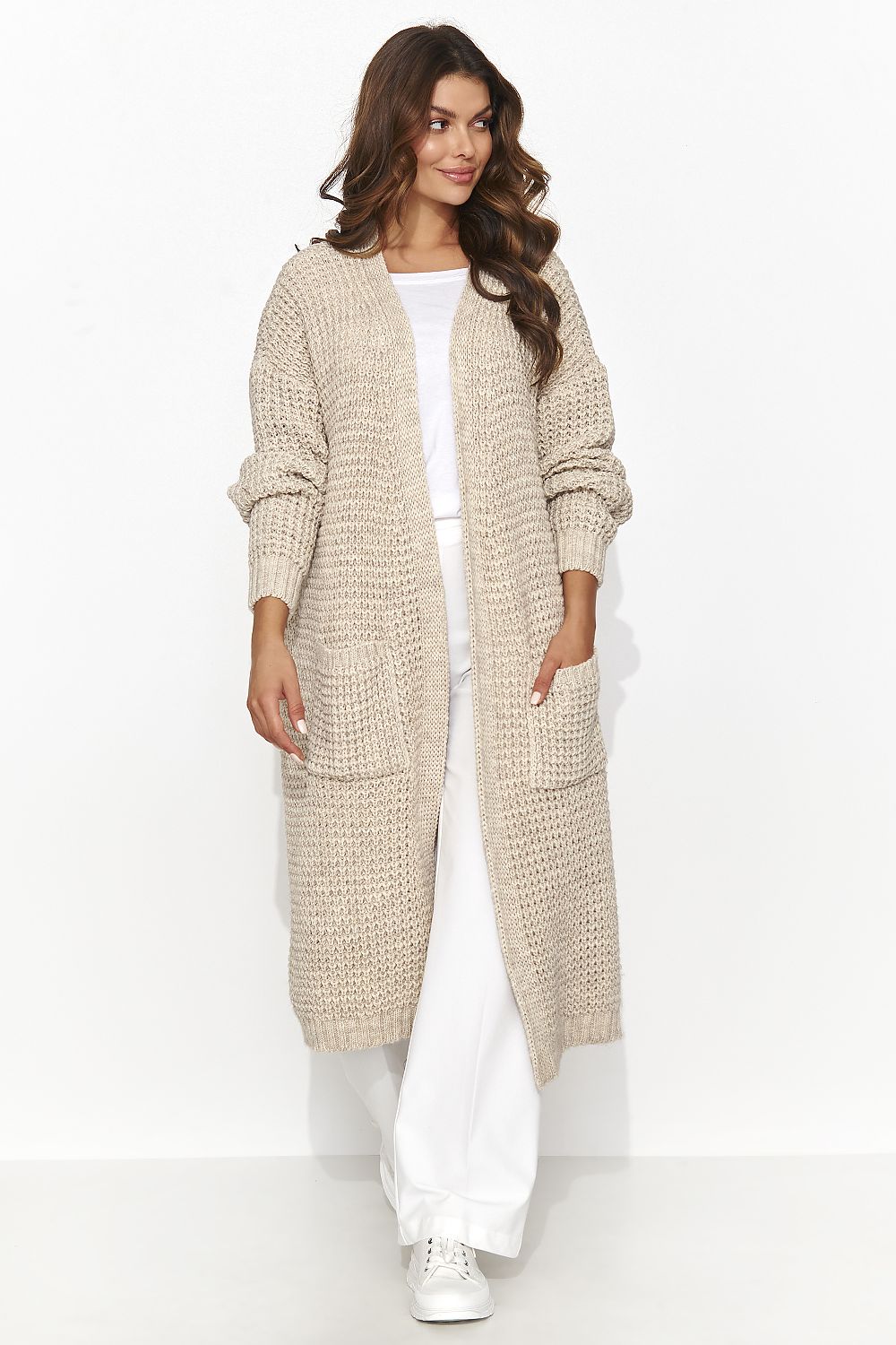 Lightweight knee-length women's cardigan by Numinou, showcasing a timeless look with functional pockets ideal for both casual and formal occasions.