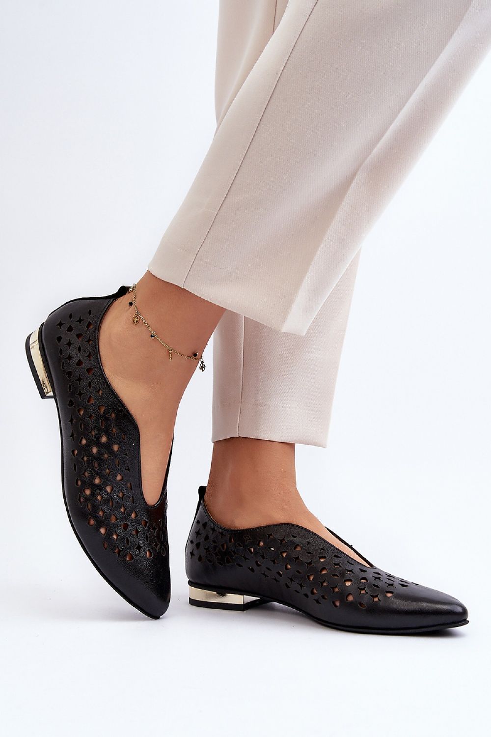 Sophisticated and stylish women's natural leather ballerina flats with a delicate openwork design, presented by Step in Style.
