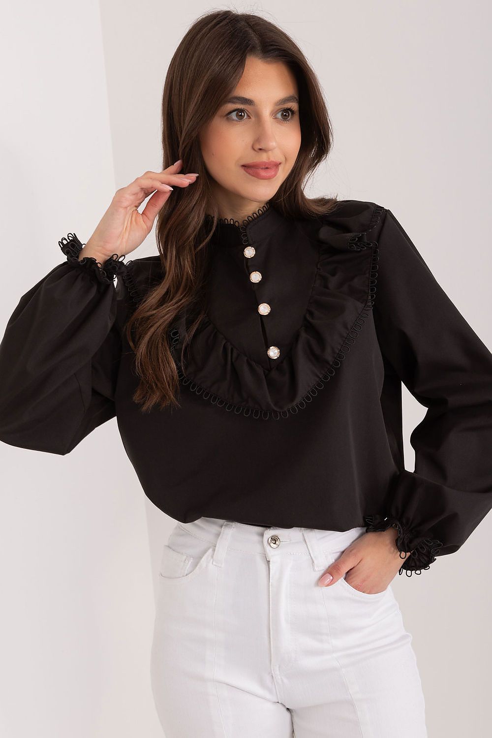 Stylish close-up of the decorative ruffle detail on the Lakerta blouse, highlighting its feminine elegance and charm.