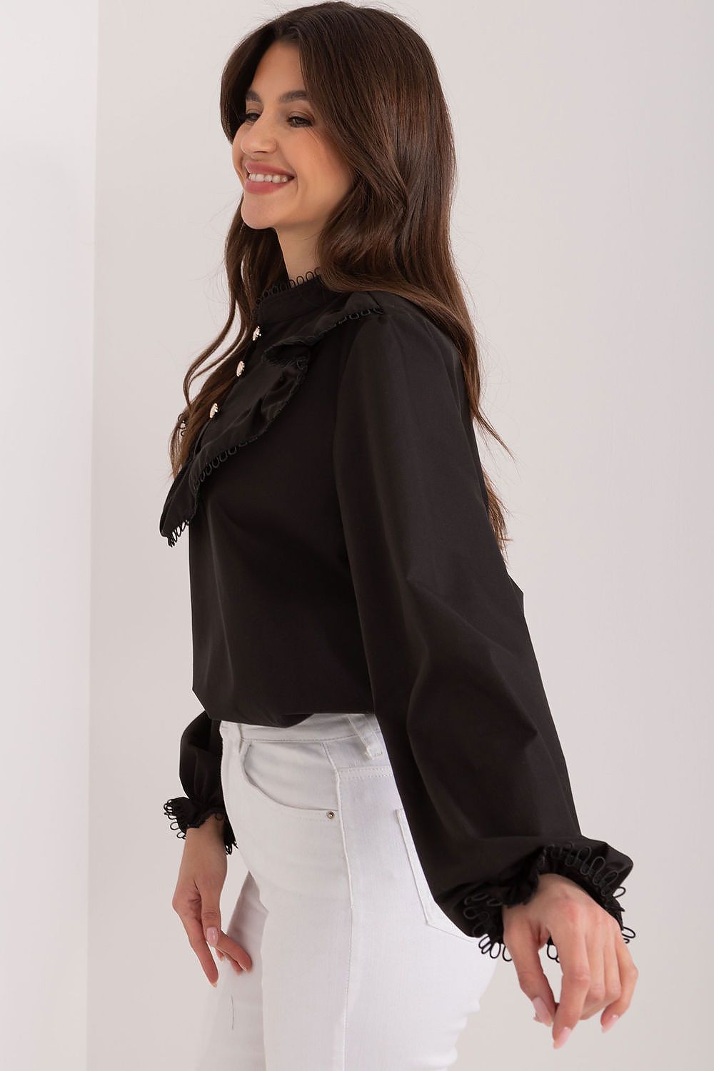 Model wearing the elegant Lakerta blouse with a stand-up collar, exuding confidence and luxury in a business meeting attire.