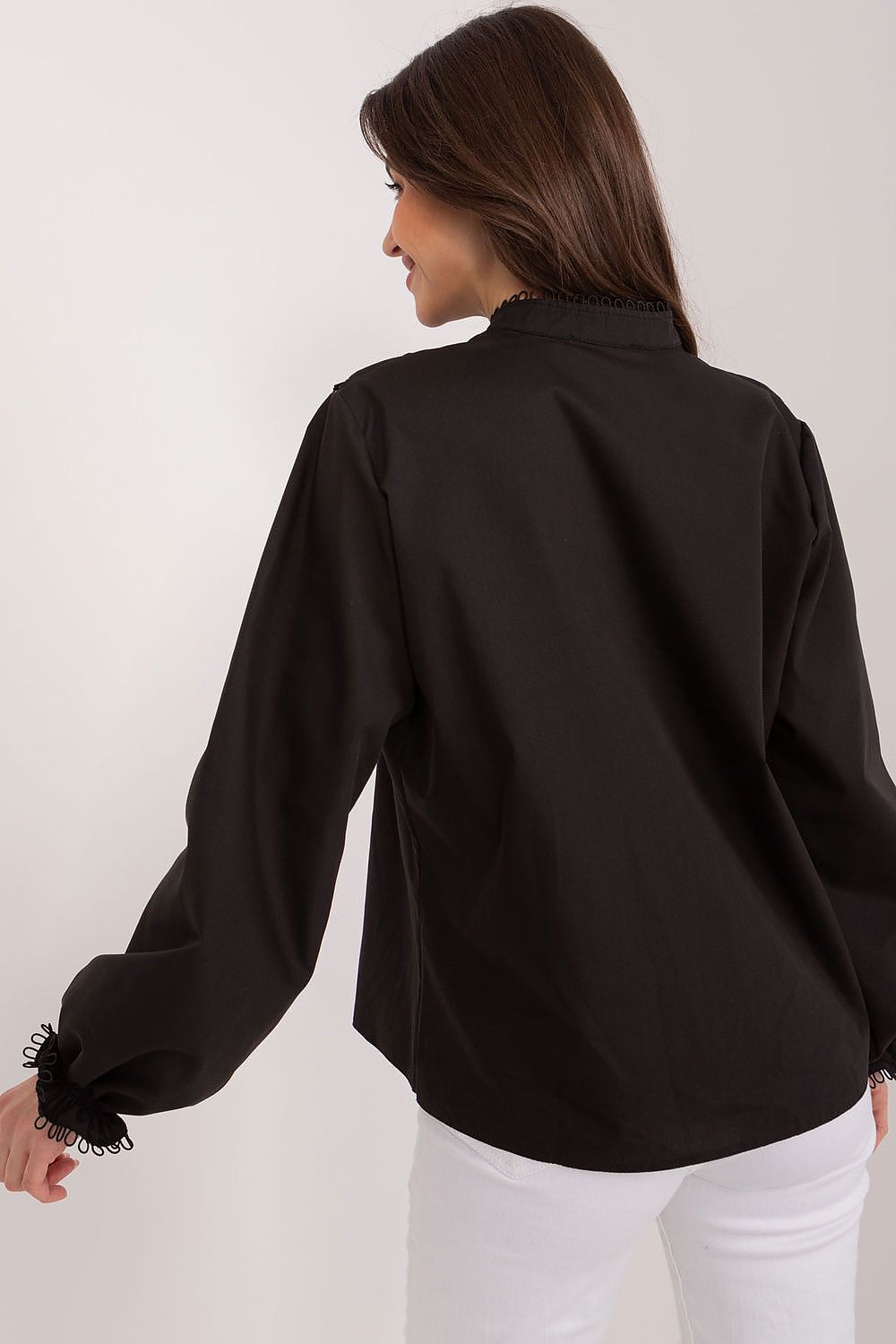 Flat lay of the Lakerta blouse displaying its smooth cotton fabric and exquisite puff sleeve design, ideal for versatile occasions.