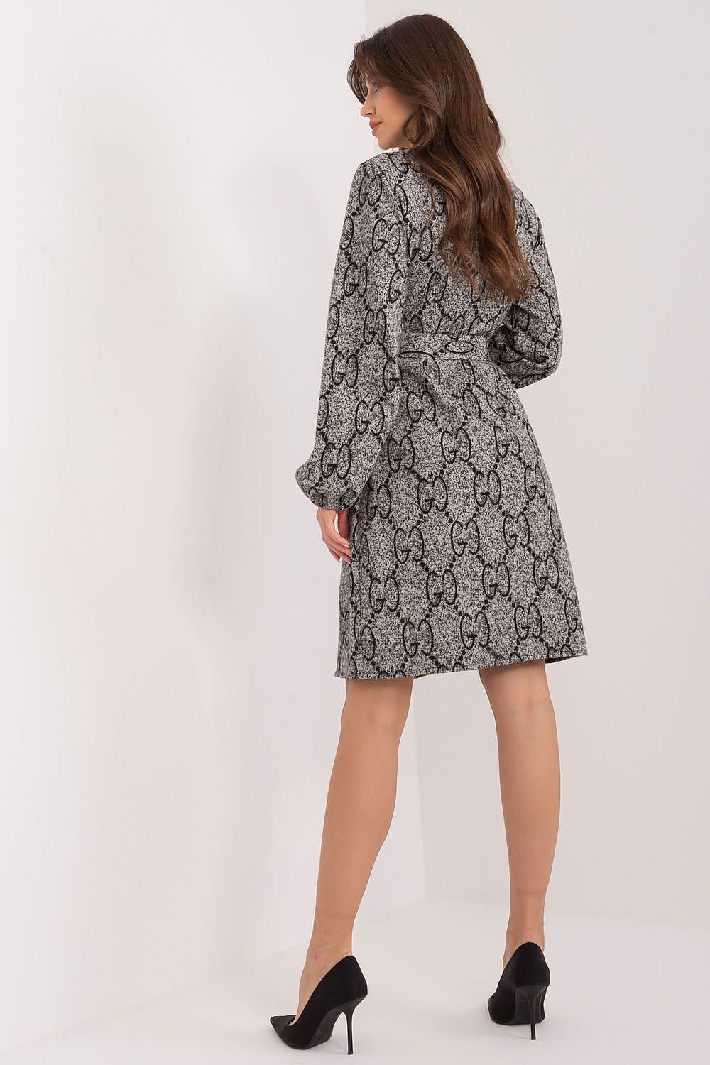 Stylish close-up of the Lakerta cotton knit dress showcasing its unique patterned fabric and exquisite puff sleeve design.