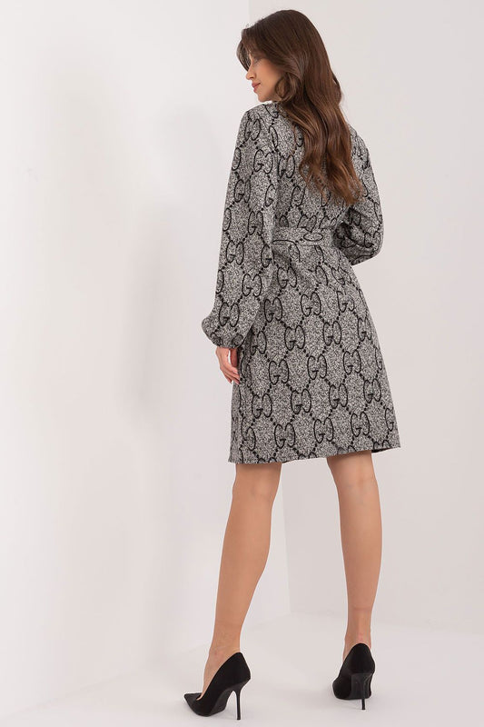Stylish close-up of the Lakerta cotton knit dress showcasing its unique patterned fabric and exquisite puff sleeve design.