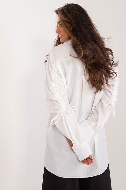 Elegant Lakerta Women's Long Sleeve Casual Shirt featuring decorative ribbing, designed for comfort and style.