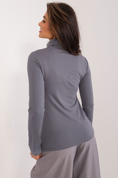 Elegant fitted women's cotton blouse with turtleneck and long sleeves by Lakerta, showcasing versatile everyday style suitable for various occasions.