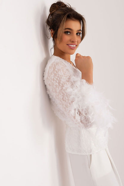 Stylish envelope front detail of Lakerta's elegant blouse, highlighting the unique texture and sophisticated style ideal for any elegant event.