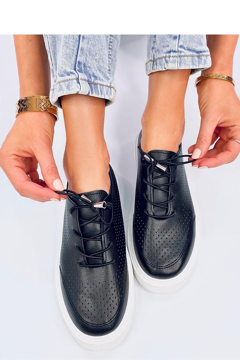 Close-up of Inello women's eco leather sneakers, highlighting the breathable openwork design and fashionable high sole for a chic look.