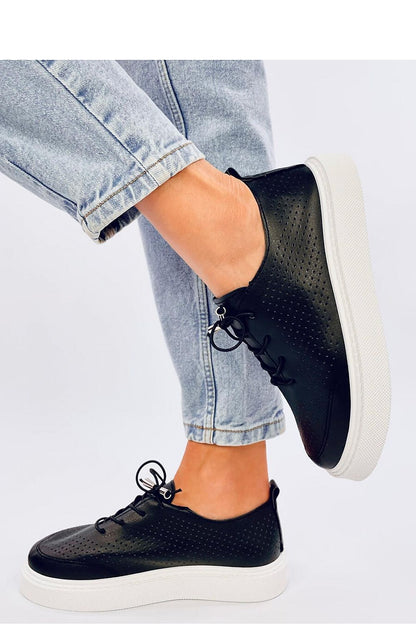 Side view of luxurious women's sneakers by Inello made from soft eco leather, showcasing a modern high sole for superior comfort and trendy fashion.