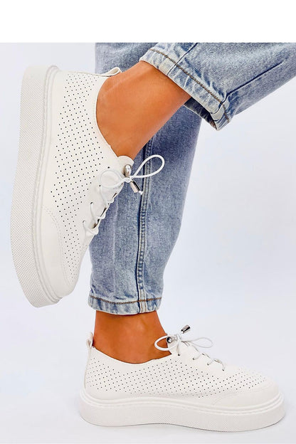 Elegant Inello women's sneakers showcasing a trendy punched texture and high sole for confident stepping.