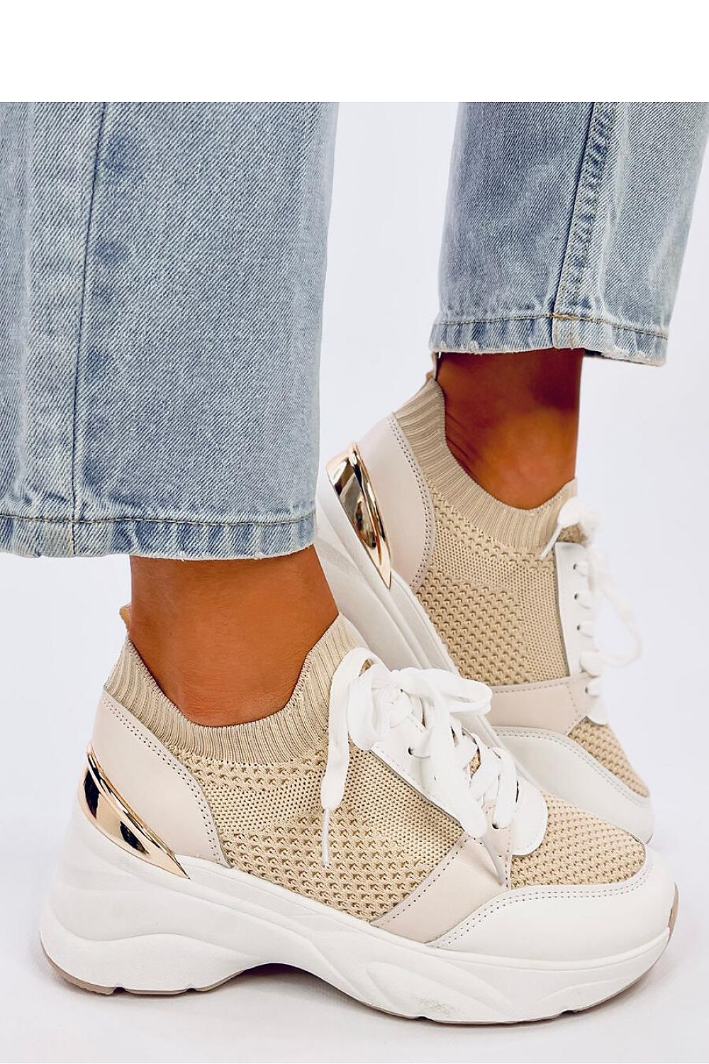 Close-up of Inello women's comfortable wedge heel sneakers made from ecological leather and fabric, showcasing their luxury and modern sporty aesthetics.