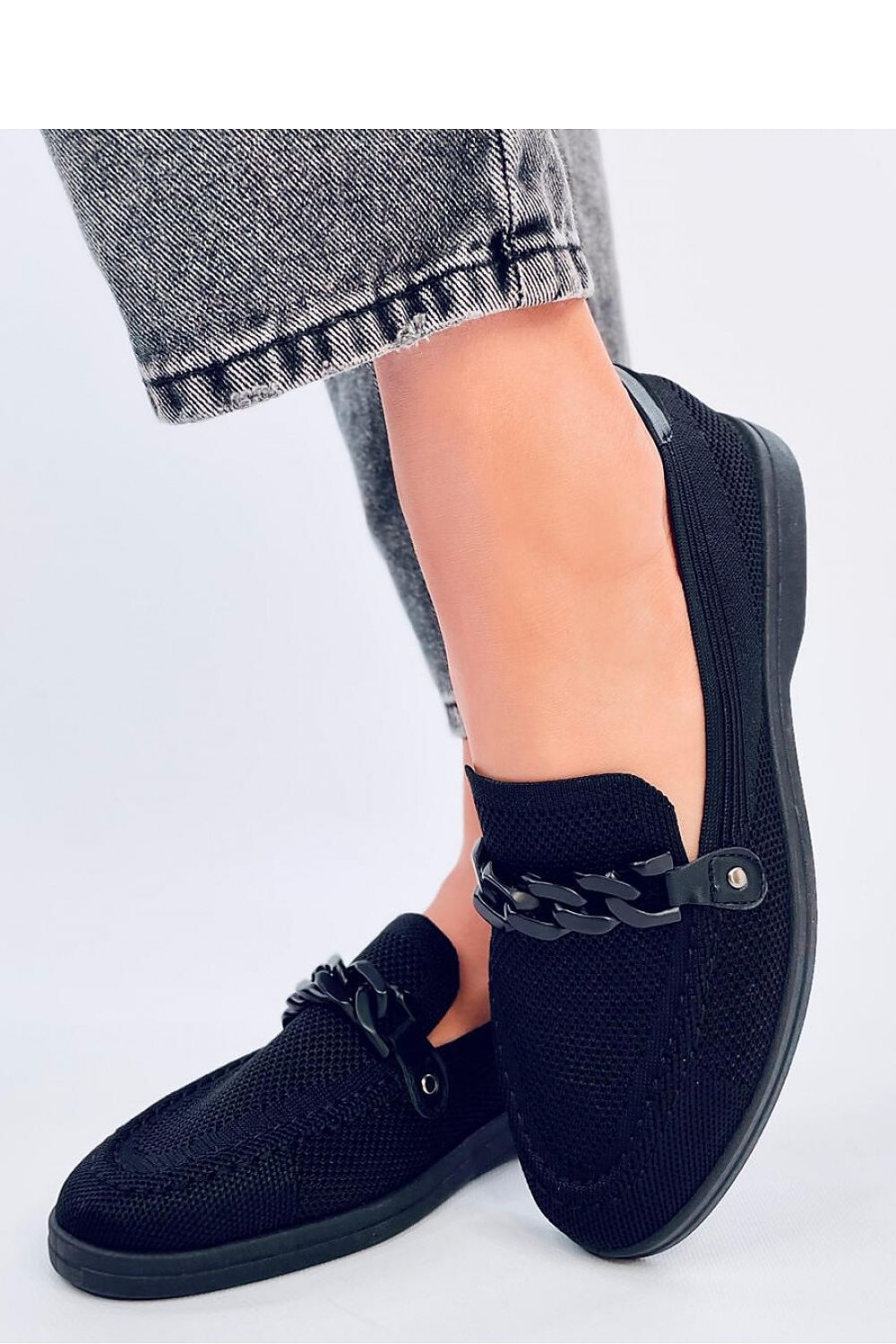 Elegant chain detail on premium openwork moccasins by Inello, crafted from ecological suede for a stylish and breathable footwear option.