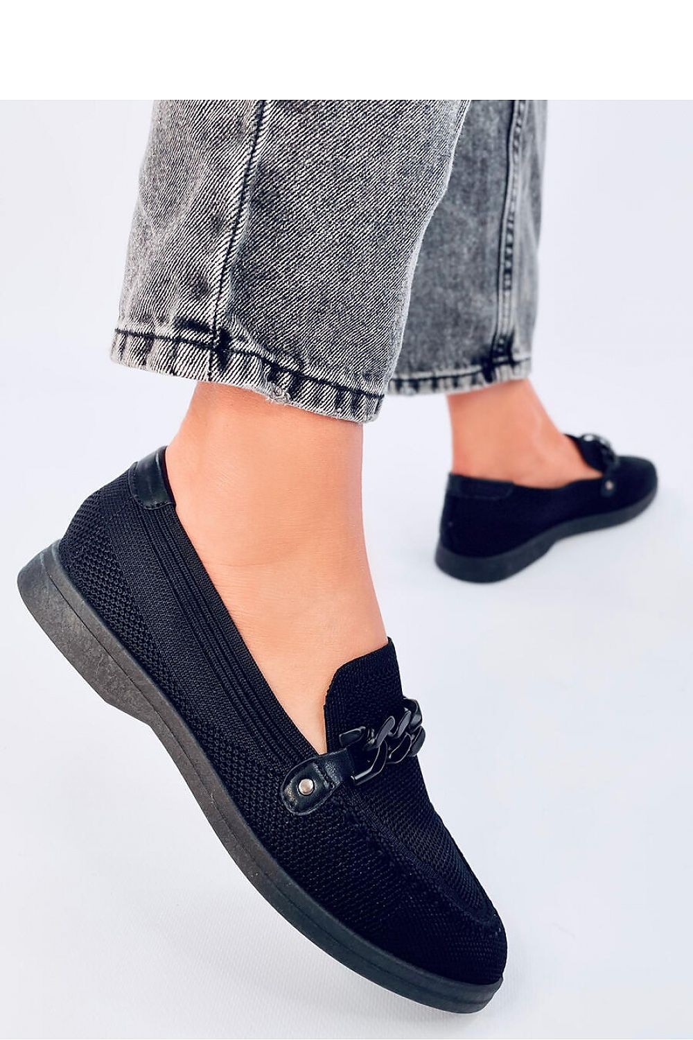 Chic luxury moccasins with a comfortable cushion insole, designed by Inello, showcasing a delicate airy pattern and sophisticated chain ornamentation.