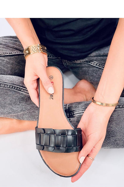 Close-up of Inello's luxurious braided strap black flip-flops for women, highlighting eco-friendly leather craftsmanship, perfect for summer wear.