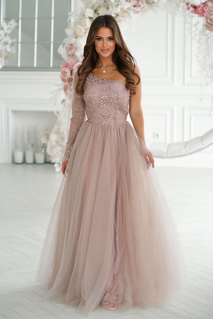 Stunning elegant one shoulder prom dress by Bicotone, featuring intricate shimmering lace and a flared mesh skirt in a soft pink hue, showcased in a beautifully lit interior.