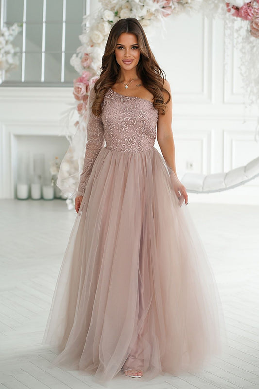 Stunning elegant one shoulder prom dress by Bicotone, featuring intricate shimmering lace and a flared mesh skirt in a soft pink hue, showcased in a beautifully lit interior.