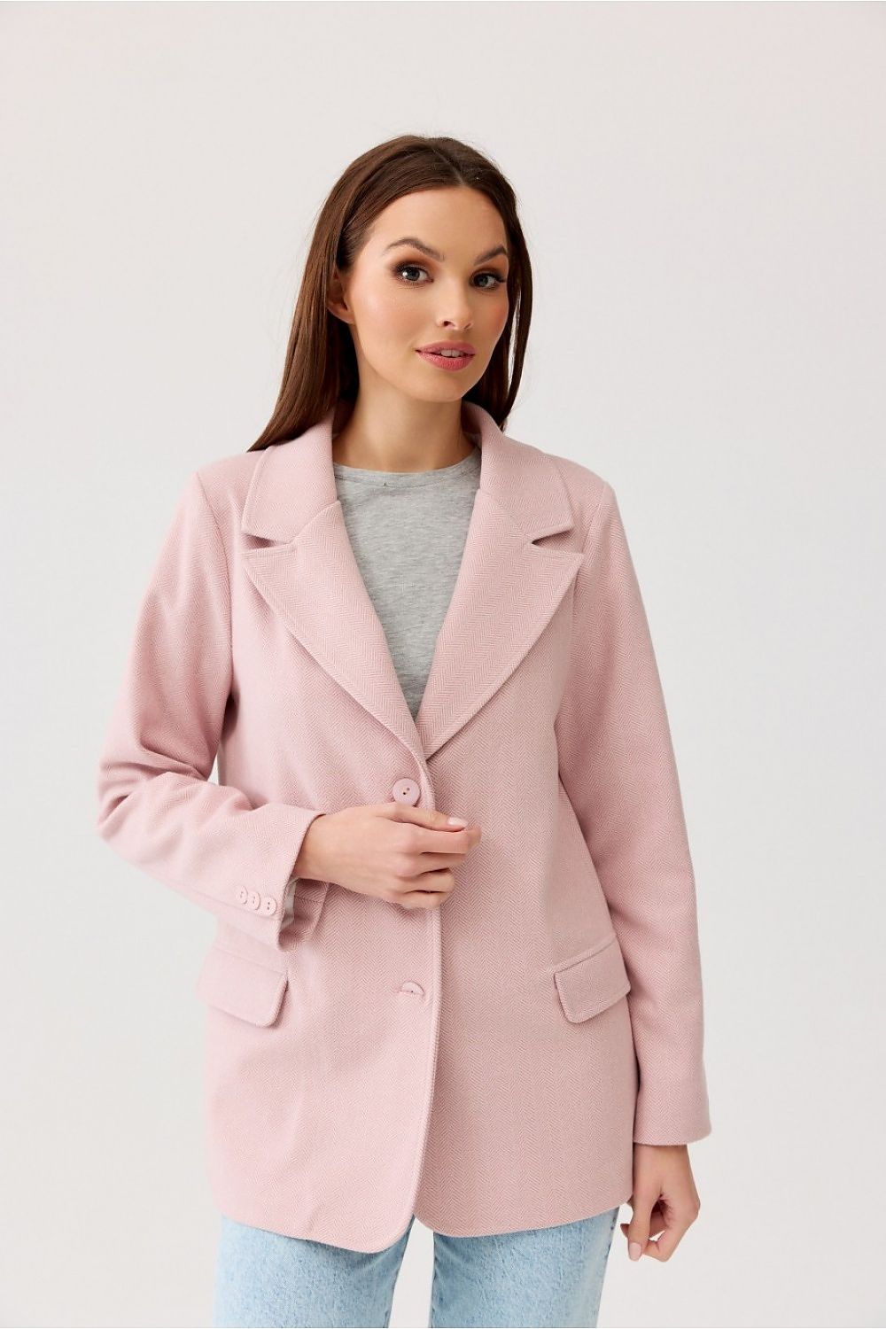 Sophisticated woman in Freya Classic Blazer Jacket by Roco Fashion, styled in a chic pink colour with button closure and flap pockets, exuding effortless elegance.