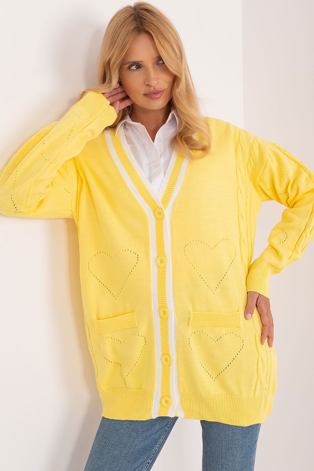 Chic Badu yellow long sleeve cardigan with contrasting white stripes and heart designs, ideal for a sophisticated look.