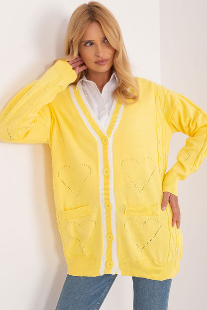 Chic Badu yellow long sleeve cardigan with contrasting white stripes and heart designs, ideal for a sophisticated look.