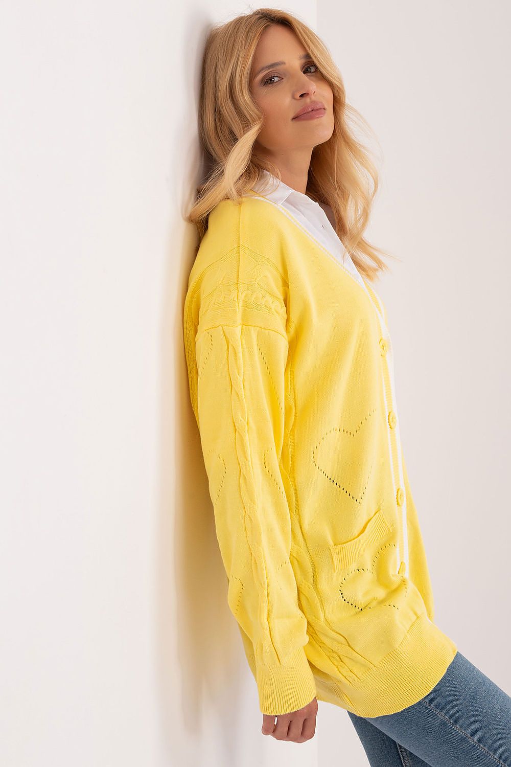 Refined view of the Badu long sleeve yellow cardigan, showcasing detailed heart patterns and elegant styling.