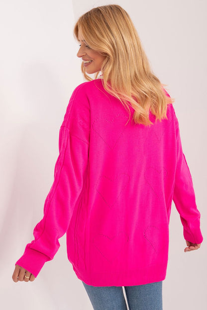 Elegant Badu long sleeve cardigan in vibrant pink featuring heart patterns, perfect for adding a stylish touch to any outfit.