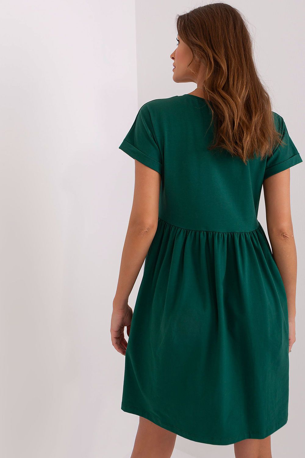 Back view of a chic flared cotton dress in green by Rue Paris, highlighting the comfortable design and short sleeves, ideal for effortless elegance.