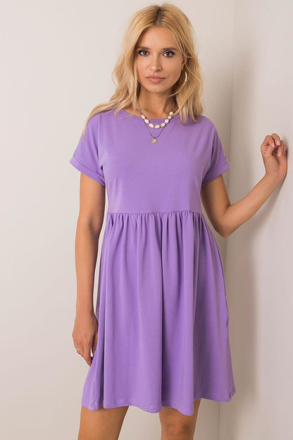 A chic light purple flared cotton dress with short sleeves, elegantly styled for everyday wear, showcased by Rue Paris.