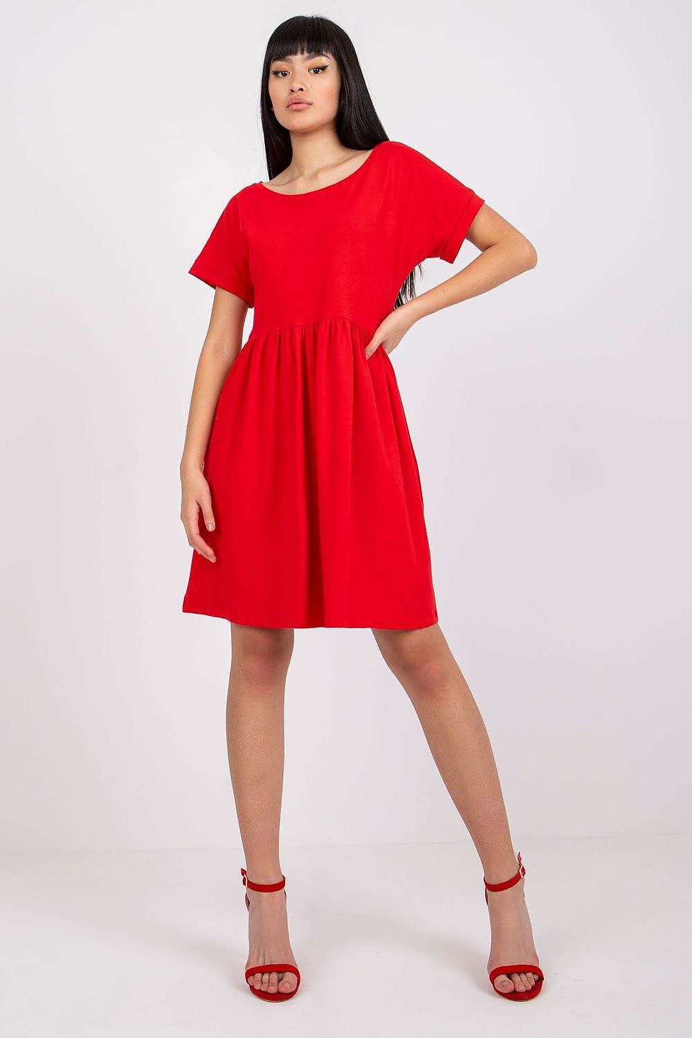An elegant red flared cotton dress with short sleeves, designed for a fashionable everyday look, presented by Rue Paris.