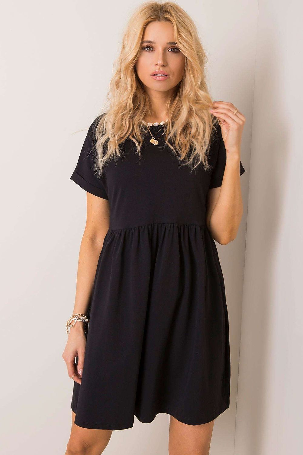 Chic Rue Paris flared cotton dress in sophisticated black, featuring short sleeves and a comfortable fit, ideal for versatile styling.