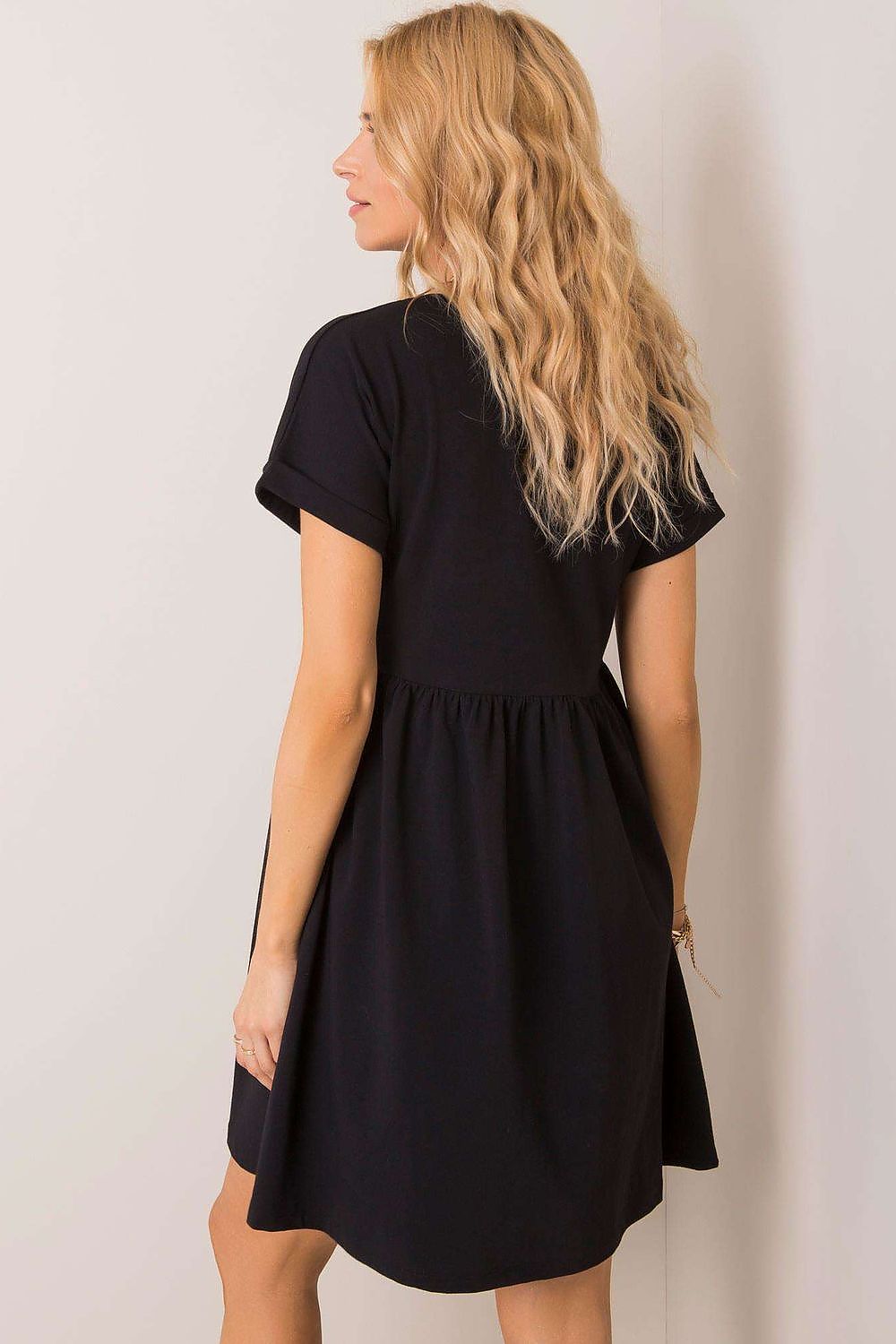 Back view of the exquisite Rue Paris black flared cotton dress, highlighting the stylish cut and breathable fabric, suitable for everyday elegance.