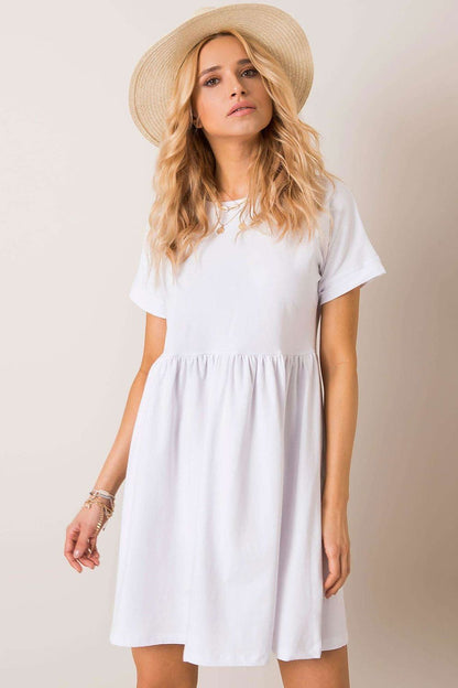 Stunning Rue Paris flared cotton dress in pristine white, adorned with short sleeves and a playful skirt, perfect for summer outings and casual gatherings.