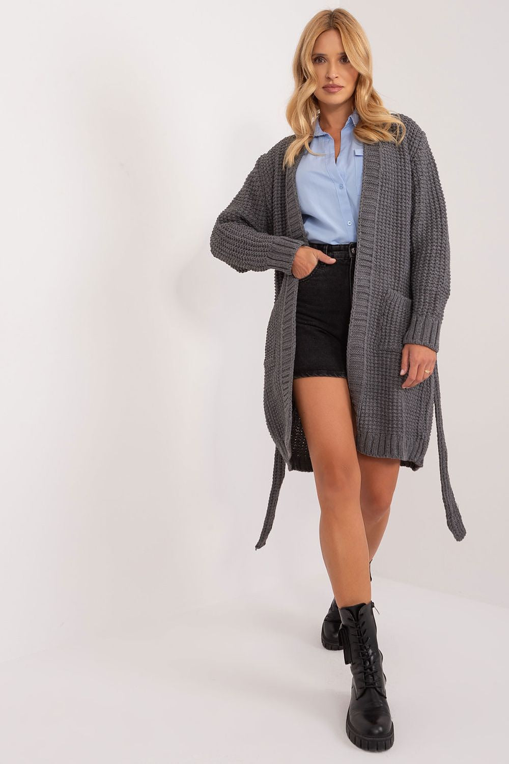 Refined grey cardigan with tie belt from Badu, displayed elegantly on a model, pairing with shorts to emphasise its versatile and stylish design.