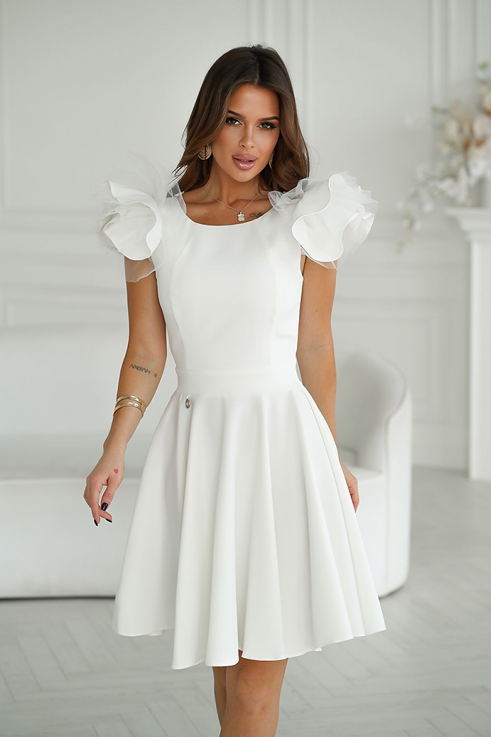 Sophisticated Bicotone white cocktail dress with luxurious shoulder ruffles, designed for high-end gatherings and celebrations.