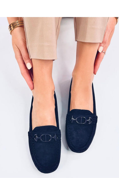 Stylish navy suede moccasins by Inello, worn by a model showcasing the shoe's sophisticated design and comfy fit.
