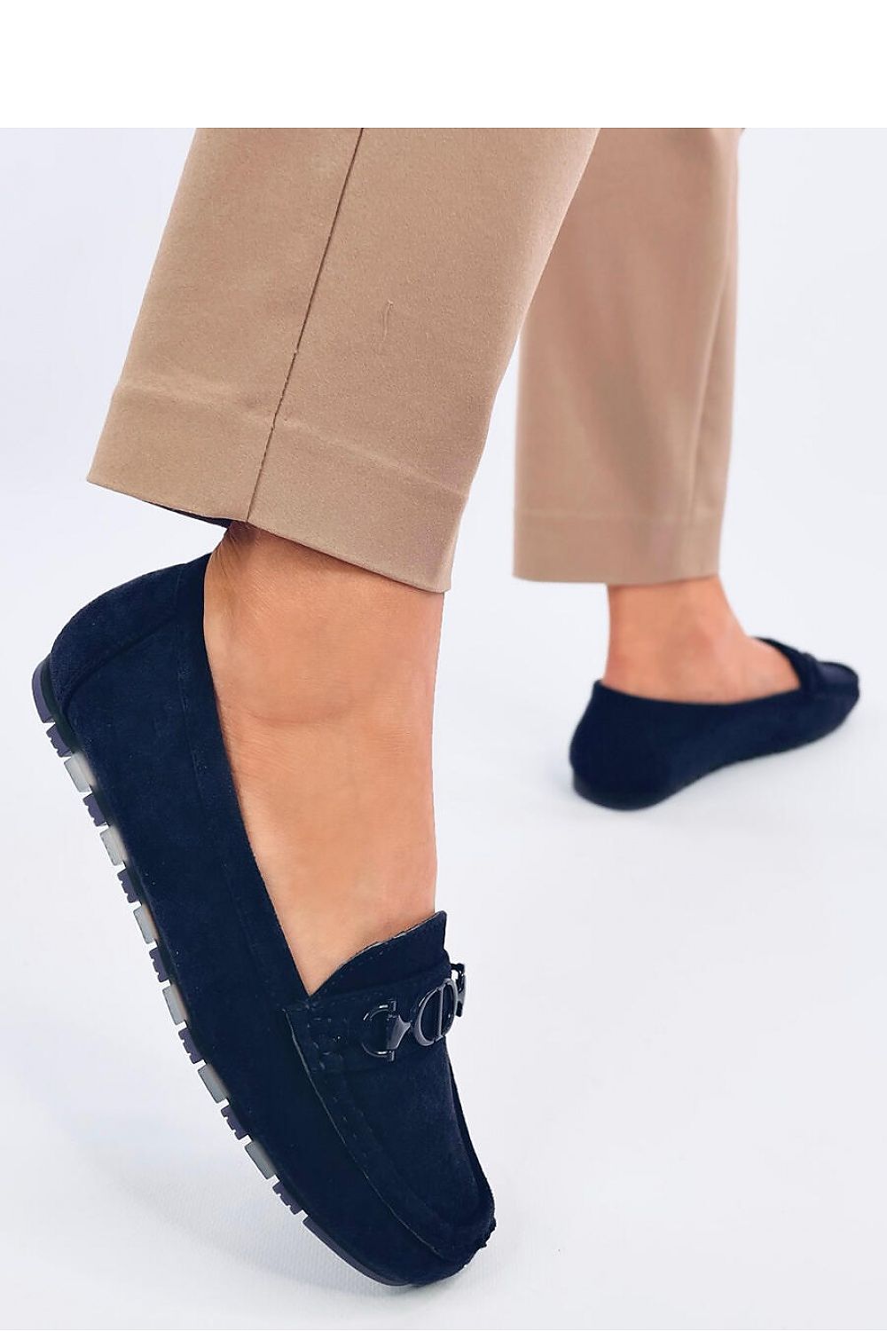 Chic navy suede moccasins by Inello, highlighted in a side view, emphasizing the soft cushion insole and trendy appearance.