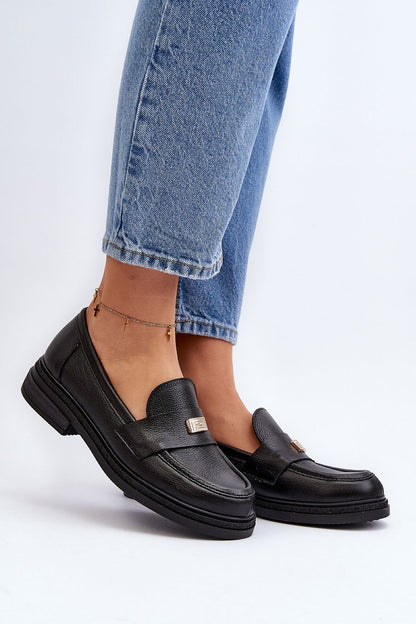 Elegant black leather moccasins for women, beautifully styled with denim, incorporating luxurious comfort and fashion by Step in Style.