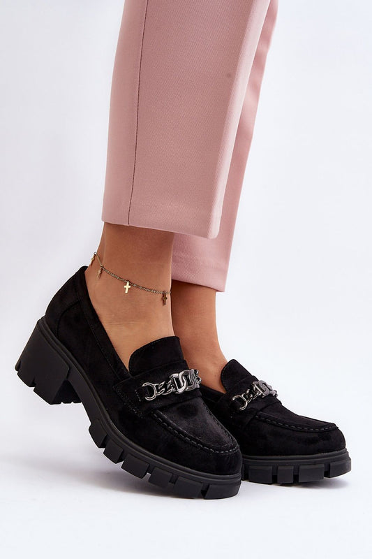 Luxury eco-suede women's moccasins by Step in Style, featuring a chic chain detail and a comfortable leather insole, elegantly styled with pink trousers.